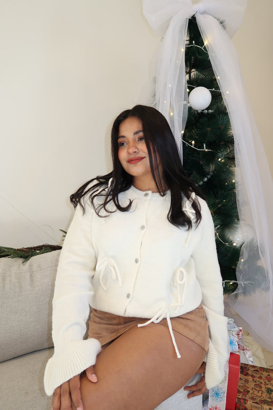 Suéter manga larga moños